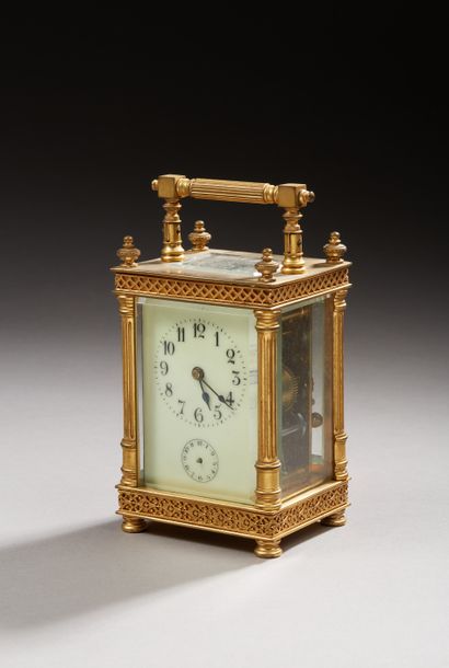 null Officer's clock in gilded brass, rectangular shape with cage, standing on four...