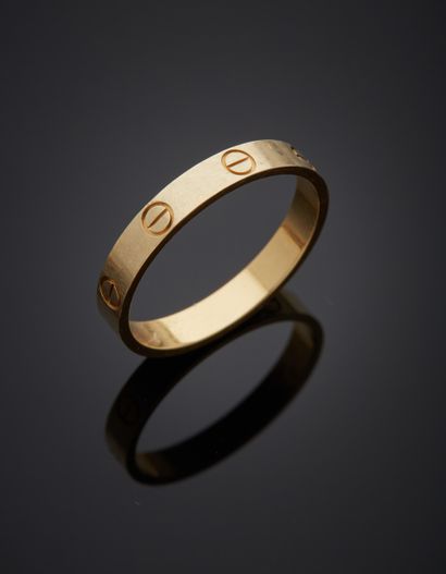 null CARTIER - 18K yellow gold 750‰ ring, "Love" model, flat band with screw decoration....