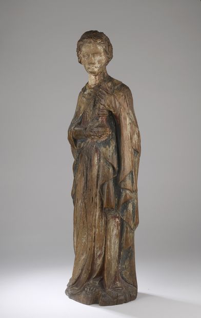 null France, 18th century 
Holy woman holding a candlestick
Round wooden sculpture...