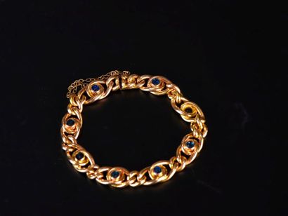 Un bracelet en or jaune 18K 750‰ composé...