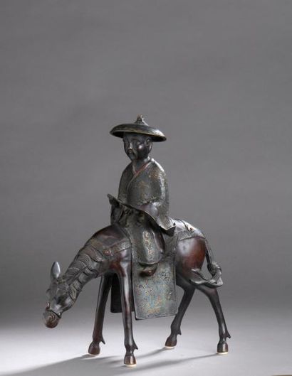 null STATUETTE en bronze et émaux cloisonnés représentant Toba sur sa mule. Usures...