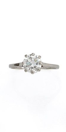 null 18K (750/1000) white gold solitaire set with a brilliant-cut diamond weighing...