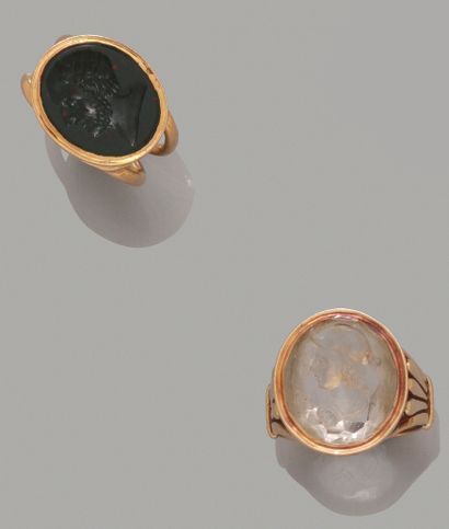 null Set of two oval intaglios in closed setting, one in transparent glass representing...