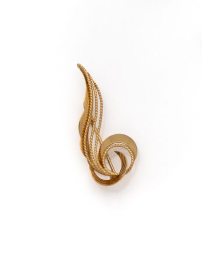 null Broche en or jaune 18K (750/1000) représentant une volute composée de fils d'or...