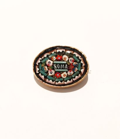 null Gilded metal brooch with micro mosaic decoration, inscription "ROMA".

Size...