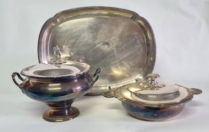 null Set in silvered matel including a tray with a curved edge, a tureen resting...