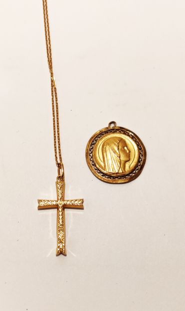 null Baptismal set including a cross in pendant, a medal of the Virgin signed and...