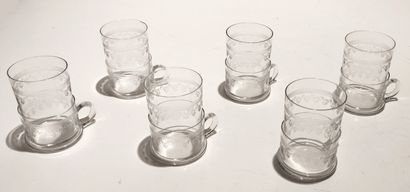null Six glass holders and its tea glasses in blown glass.

Saint Petersburg glassworks,...