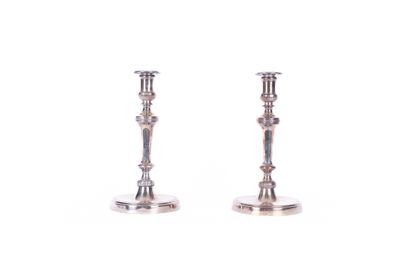 Pair of candlesticks in silver plated metal...