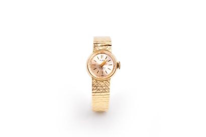 null IAXA (Vers 1960). 

Montre dame tour de bras en or 18K(750/1000), poids brut:...