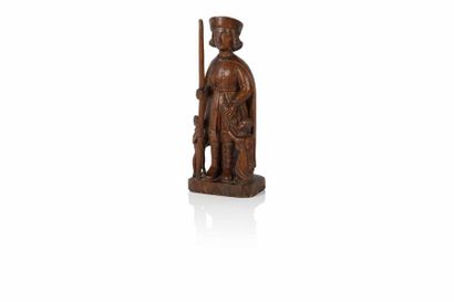 null Figure en chêne sculpté représentant Saint Roch tenant un bâton, avec un ange...