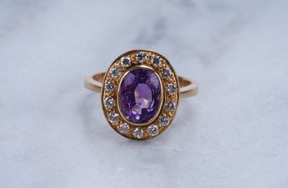 Bague, or jaune, améthyste et diamants Ring, in 18K yellow gold set with an amethyst...