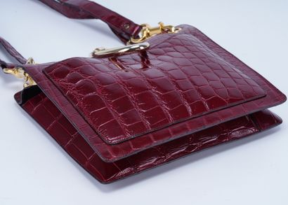 Christian Dior Christian Dior handbag, shiny red crocodile leather and gold metal....