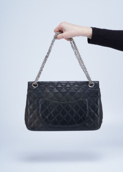 Chanel Chanel handbag in black quilted leather, clasp decorated with crossed Cs....