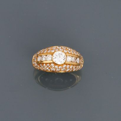 null Domed yellow gold ring, 750 MM, covered with diamonds around a brilliant weighing...