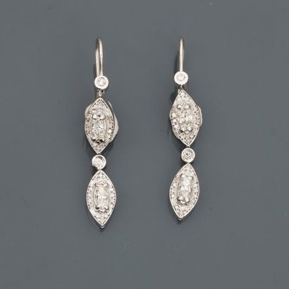 null White gold earrings, 750 MM, each adorned with two shuttle-cut diamonds and...