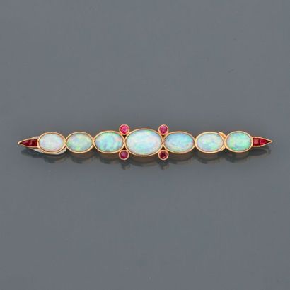 null Pretty yellow gold barrette brooch, 750 MM, highlighted with seven oval opals,...