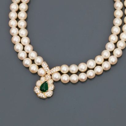 null Necklace of two rows of cultured pearls, 750 MM, decorated with a yellow gold...