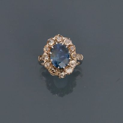 null White gold ring, centred on an oval sapphire weighing about 3.50 carats in a...
