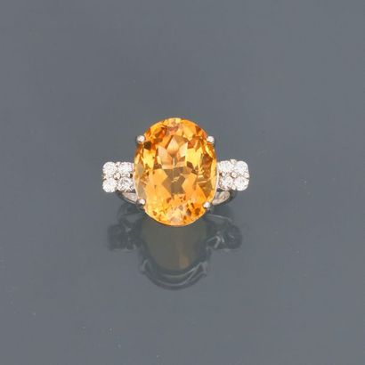 null White gold ring, 750 MM, decorated with a citrine weighing about 12 carats and...