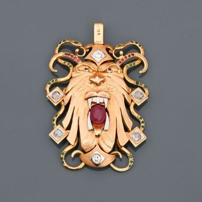 null Pendant in "Mask" of yellow gold, 750 MM, centred on an oval cabochon ruby and...