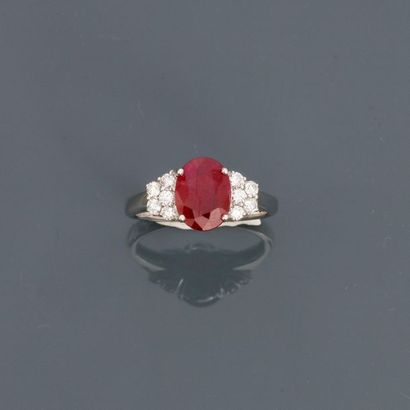 null White gold ring, 750 MM, decorated with an oval ruby weighing 1.86 carats hemmed...