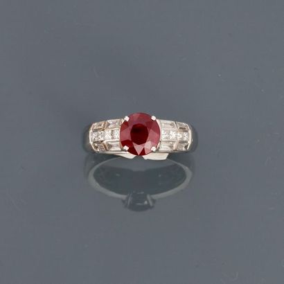 null White gold ring, 750 MM, decorated with an oval ruby weighing 2.04 carats, probably...