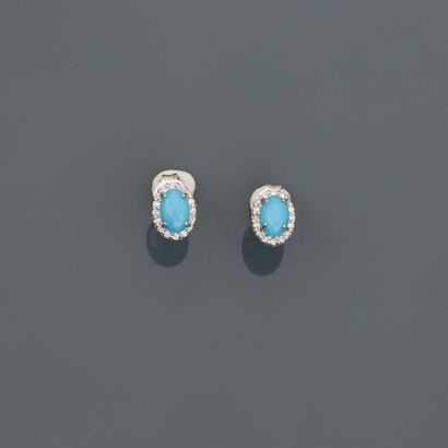 null White gold earrings, 750 MM, each adorned with a turquoise surrounded by diamonds,...