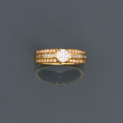 null Solitary yellow gold band ring, 750 MM, centered with a beautiful brilliant...