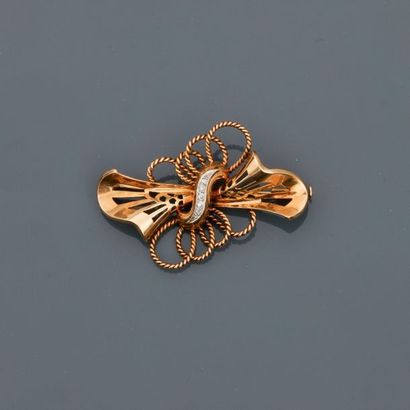 null Brooch in ribbon knotted with 750MM yellow gold and 900 MM platinum, centered...