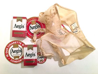 null 2 boxes of Aegis condoms. Advertising stickers and 1 garter belt, Dior Lingerie....