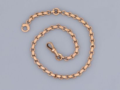 null Jolie chaîne " giletière " en or rose, longueur 25 cm, vers 1930, poids : 13,1gr....