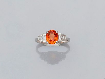null Ring in white gold, 750 MM, set with an oval orange garnet weighing about 2...