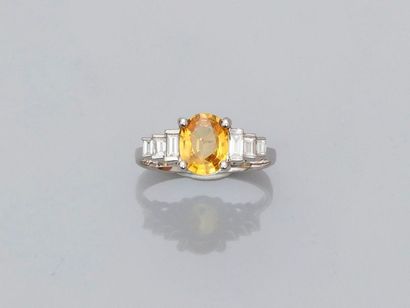 null White gold ring, 750 MM, set with an oval yellow sapphire weighing 1.55 carat...