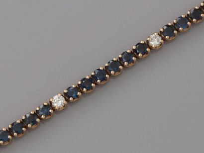 null Beautiful line bracelet in yellow gold, 750 MM, highlighted with round sapphires,...