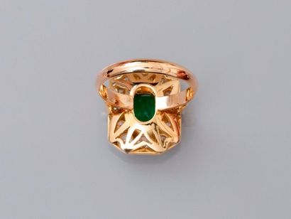 null Ring drawing a two-gold, 750 MM, centered on an emerald-cut emerald weighing...