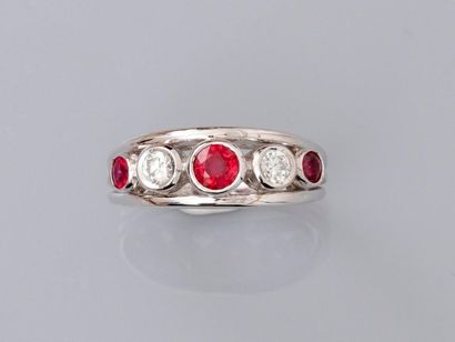 null Ring " ring " in white gold, 750 MM, decorated with three round rubies interspersed...