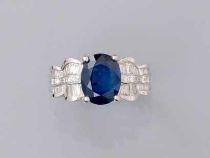 null Ring in white gold, 750 MM, centered by a beautiful oval sapphire weighing about...