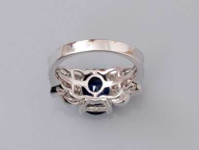 null Ring in white gold, 750 MM, centered by a beautiful oval sapphire weighing about...