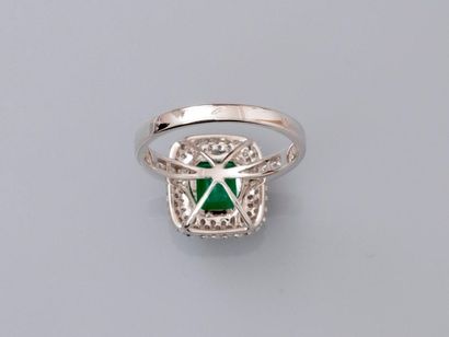 null Ring in white gold, 750 MM, centered by an emerald with cut sides weighing about...