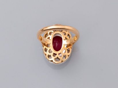 null Elegant two-gold ring, 750 MM, centered by an oval ruby weighing about 5 carats...