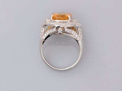 null Ring in white gold, 750 MM, centered on a large treated yellow sapphire weighing...