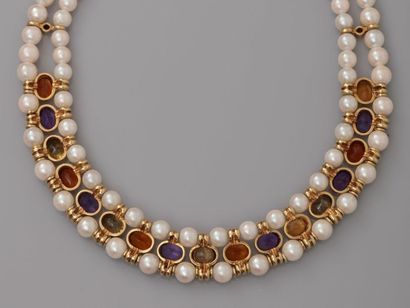 null Elegant necklace of two rows of cultured pearls interspersed with a row of oval...