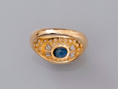 null Dome ring in yellow gold, 750 MM, centered on an oval sapphire shouldered with...