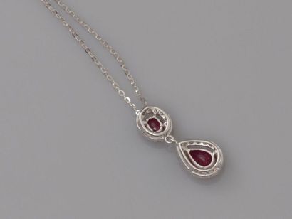 null Chain and pendant in white gold, 750 MM, decorated with two rubies each surrounded...