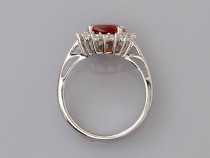 null Ring in white gold, 750 MM, decorated with an oval spessartite weighing about...