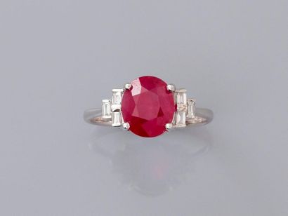 null Ring in white gold, 750 MM, set with an oval ruby weighing 3.45 carats and set...