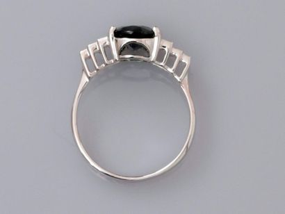 null Ring in white gold, 750 MM, set with an oval sapphire weighing 2.56 carats,...