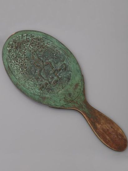 null Armand Albert RATEAU. Hand mirror in bronze with an antique brown patina, original...