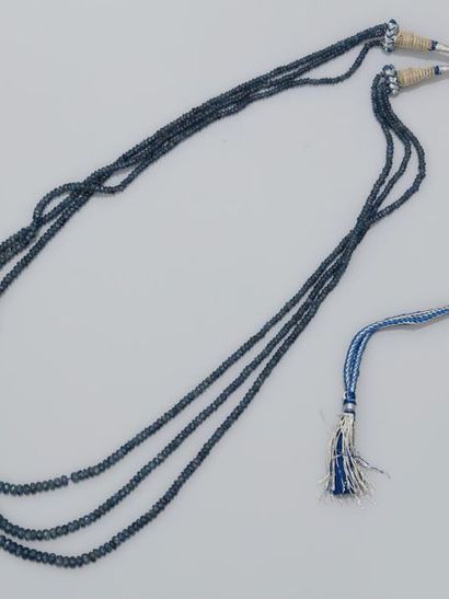 null Necklace on silk threads made of three rows of faceted sapphire pearls, adjustable...